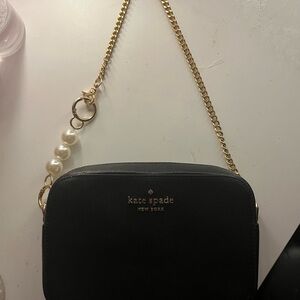 Kate Spade black shoulder purse with gold chain strap and pearl strap extender
